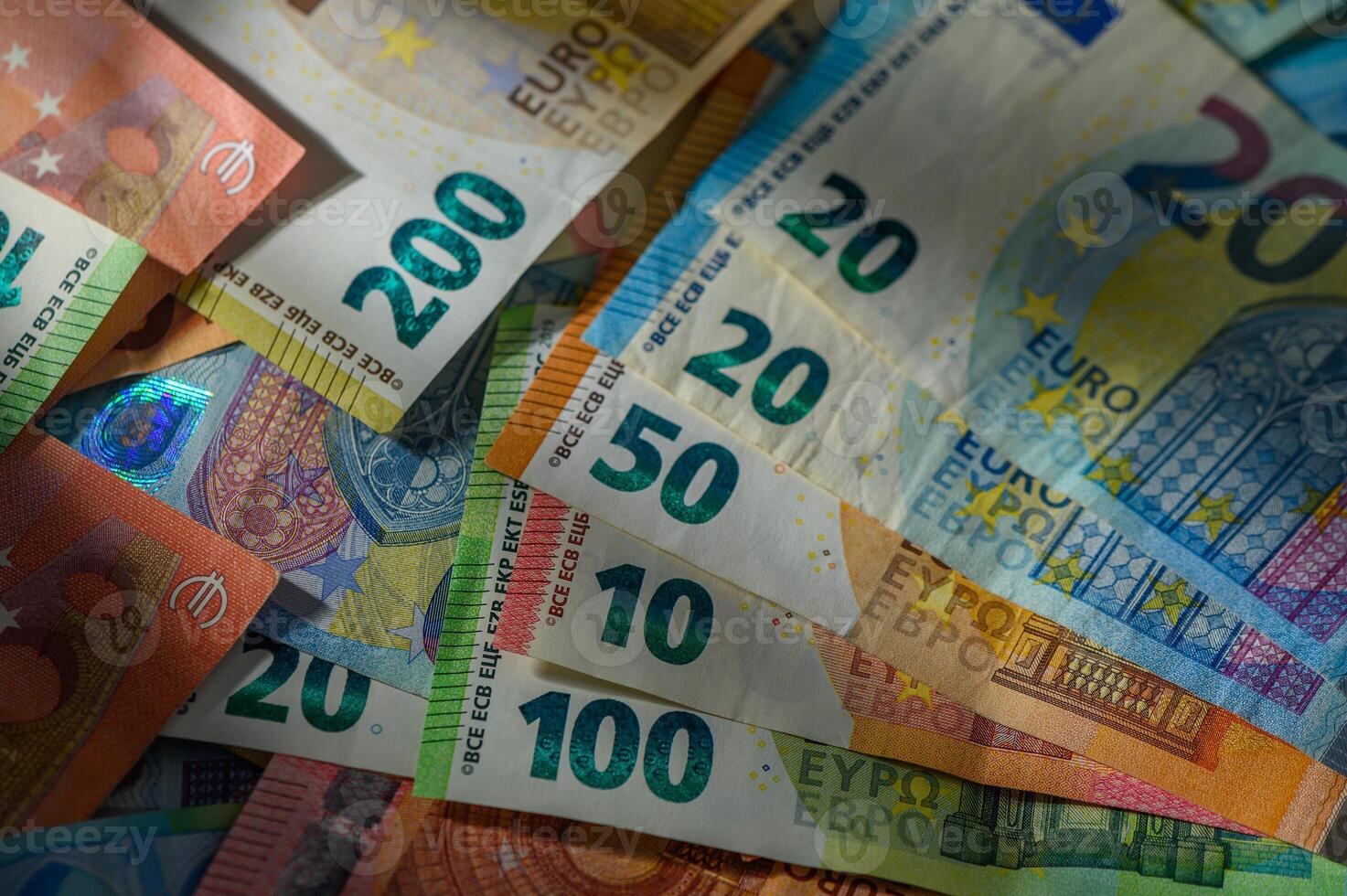Currency collection showcasing various Euro denominations in vibrant colors and details on a flat surface photo