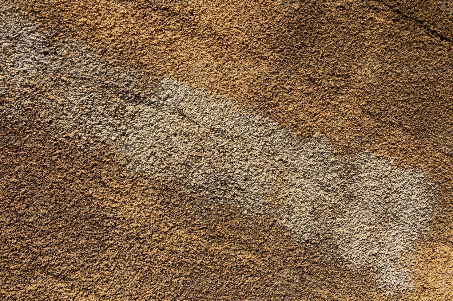 Beautiful textures of natural earth tones showcasing patterns in dry soil under warm sunlight photo