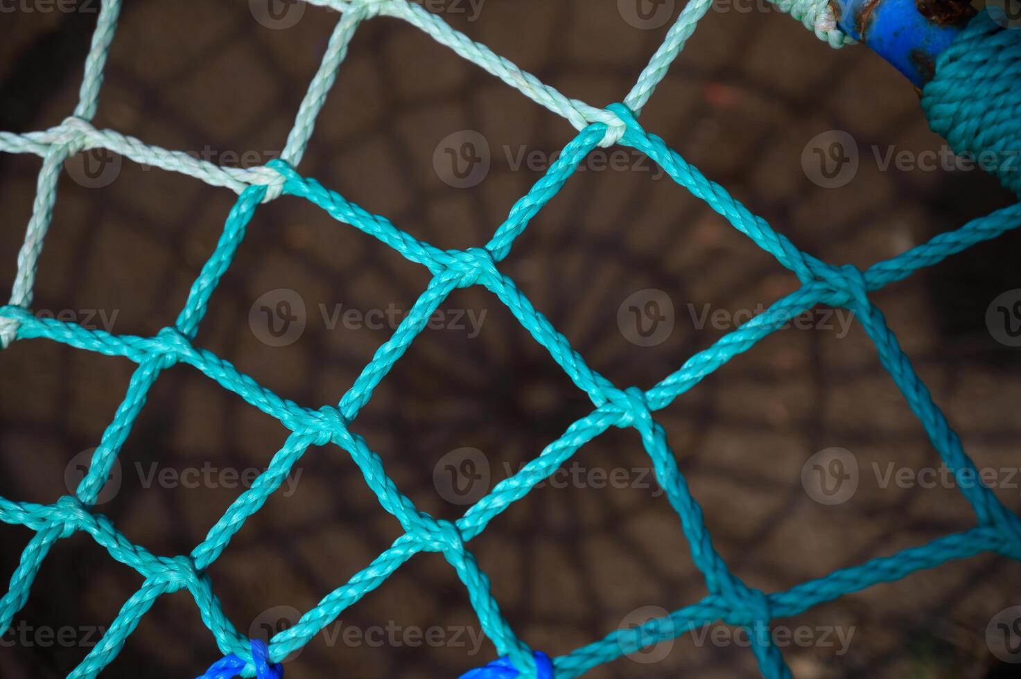 Colorful woven net creating intriguing patterns in soft light photo
