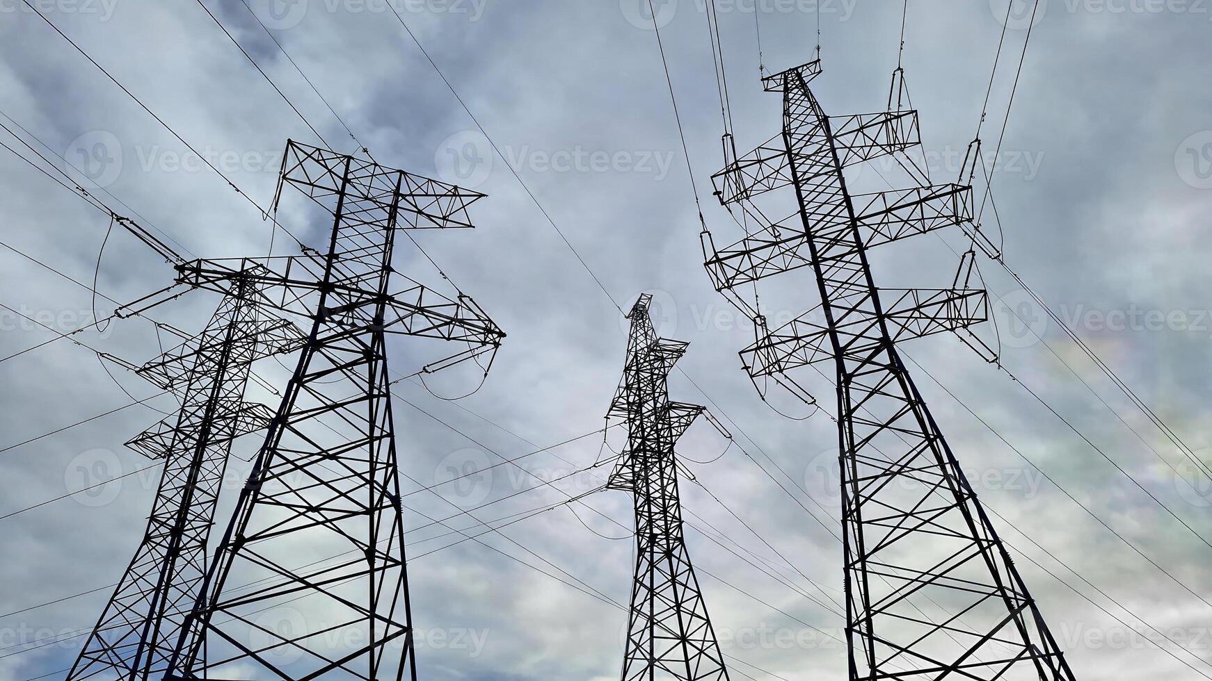 Several high voltage power lines against a cloudy sky. photo