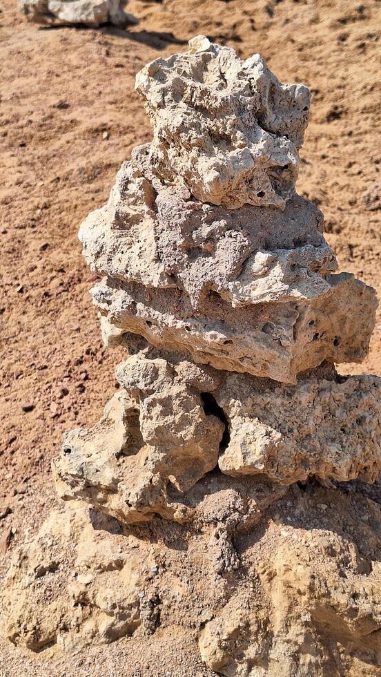 Close up of homemade pyramids made of stones. photo