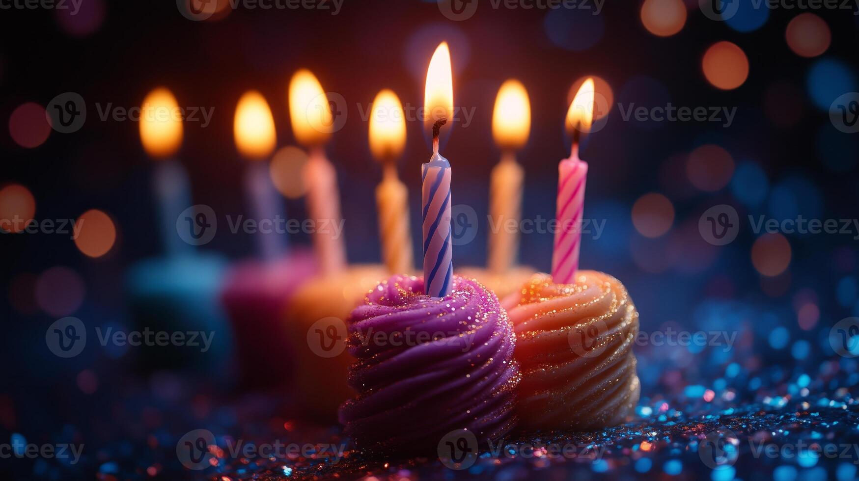 Birthday candles with colorful frosting on a table photo