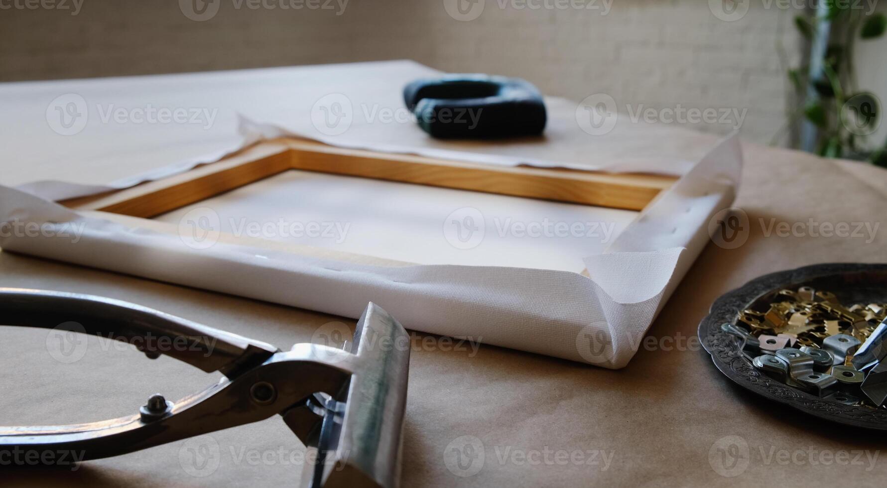 Canvas framing. Tools and accessories for stretching canvas on stretcher frame. photo