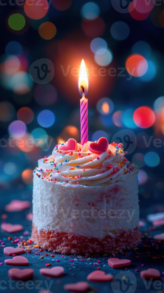 Beautiful cake with a candle and colorful decorations celebrating a special occasion photo
