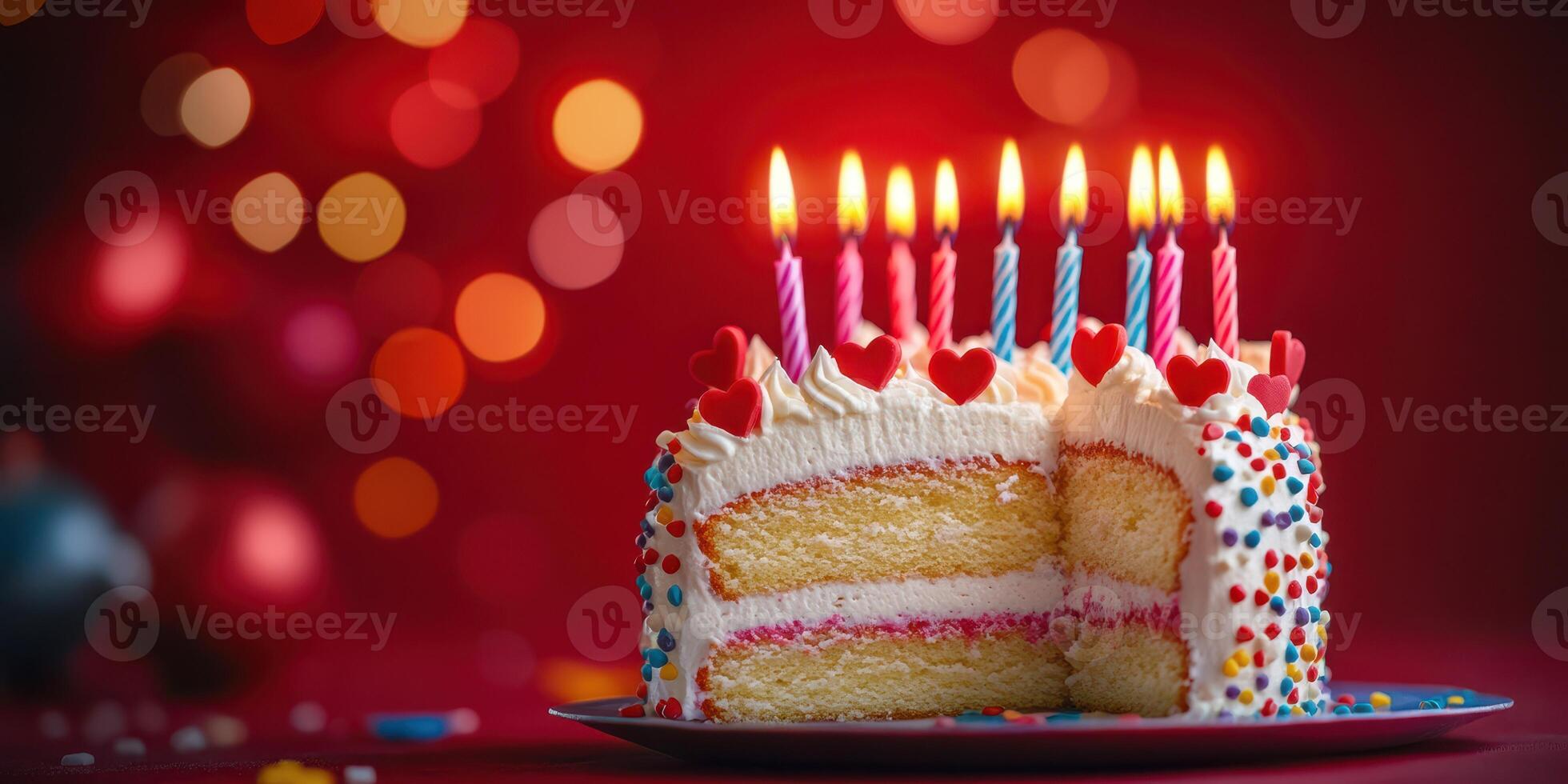Delicious birthday cake with candles and colorful decorations set against a festive backdrop photo