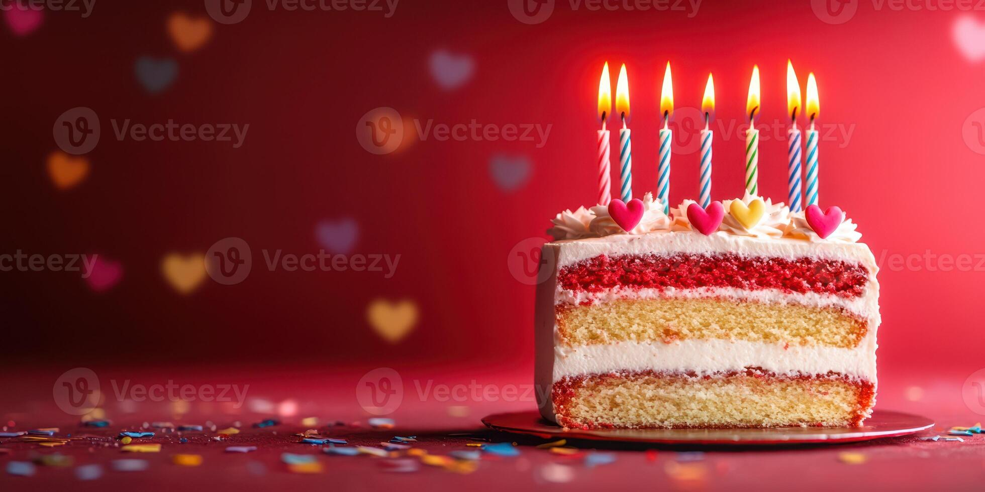 Brightly decorated cake with colorful candles and hearts for a festive celebration photo