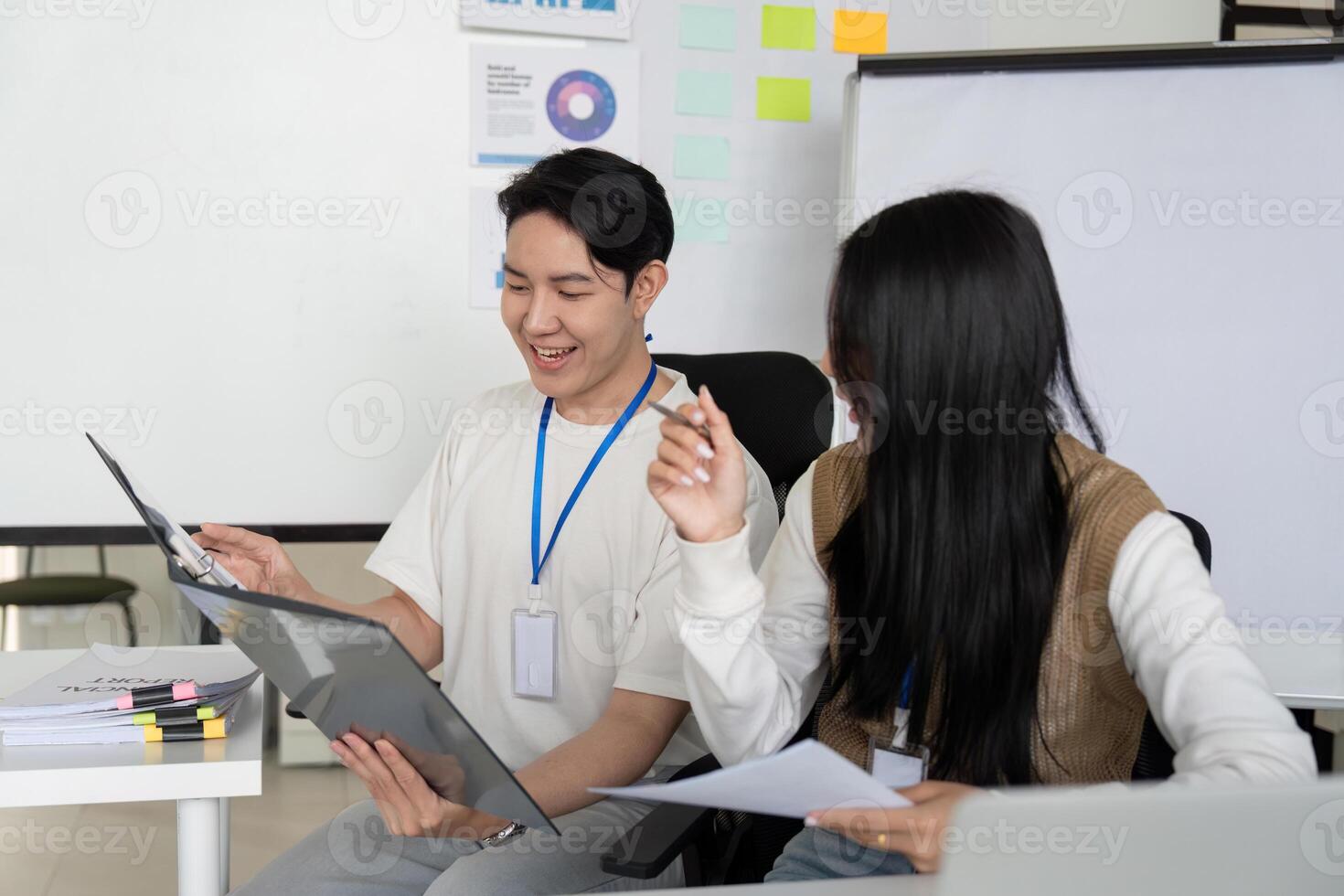 Team members collaborating on financial analysis and strategy in a modern office. photo