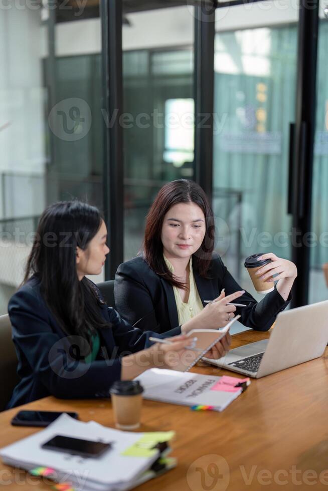 Professionals analyzing financial documents and collaborating on strategy in a bright office. photo