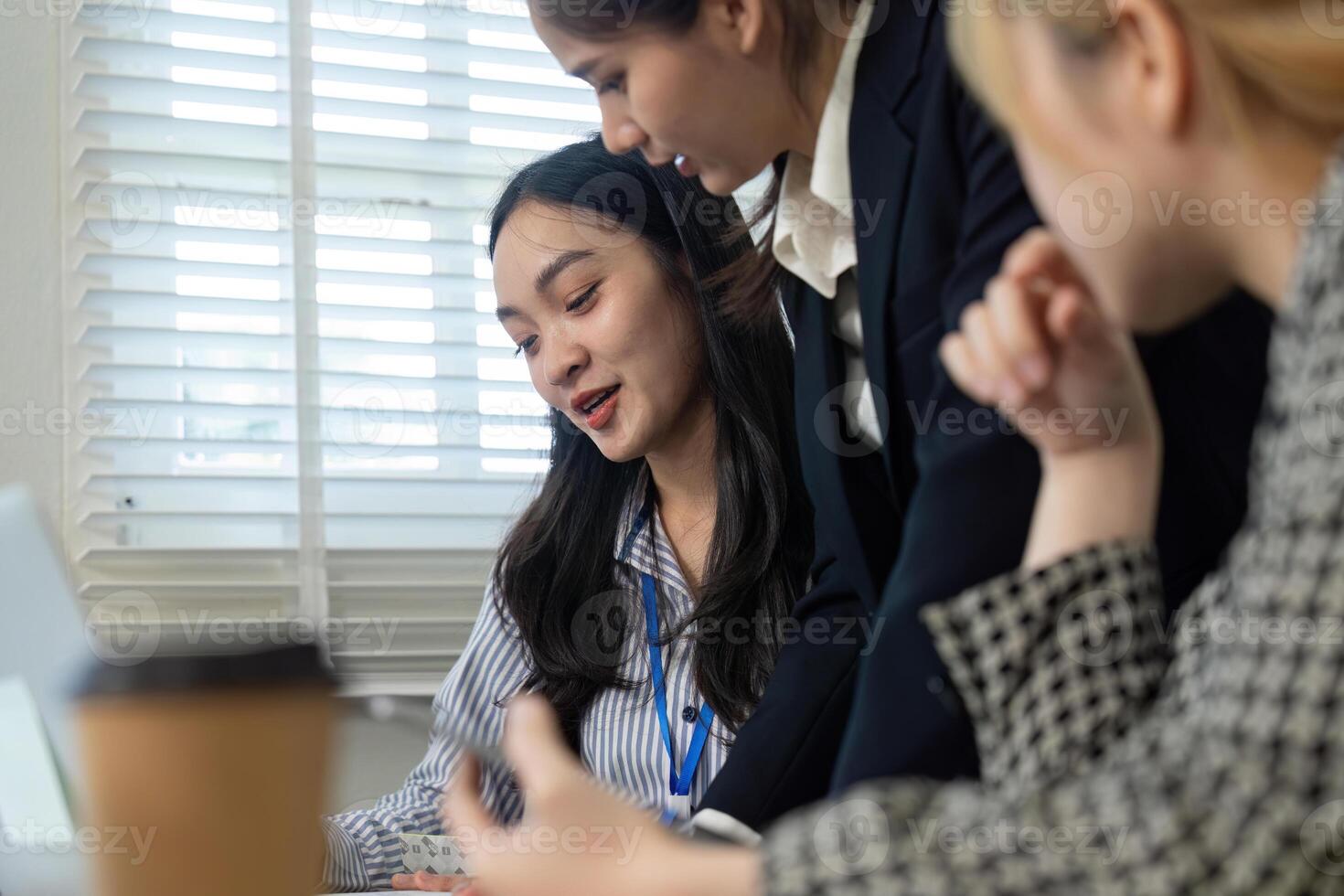 Team members analyzing data and discussing financial strategies during a collaborative meeting. photo