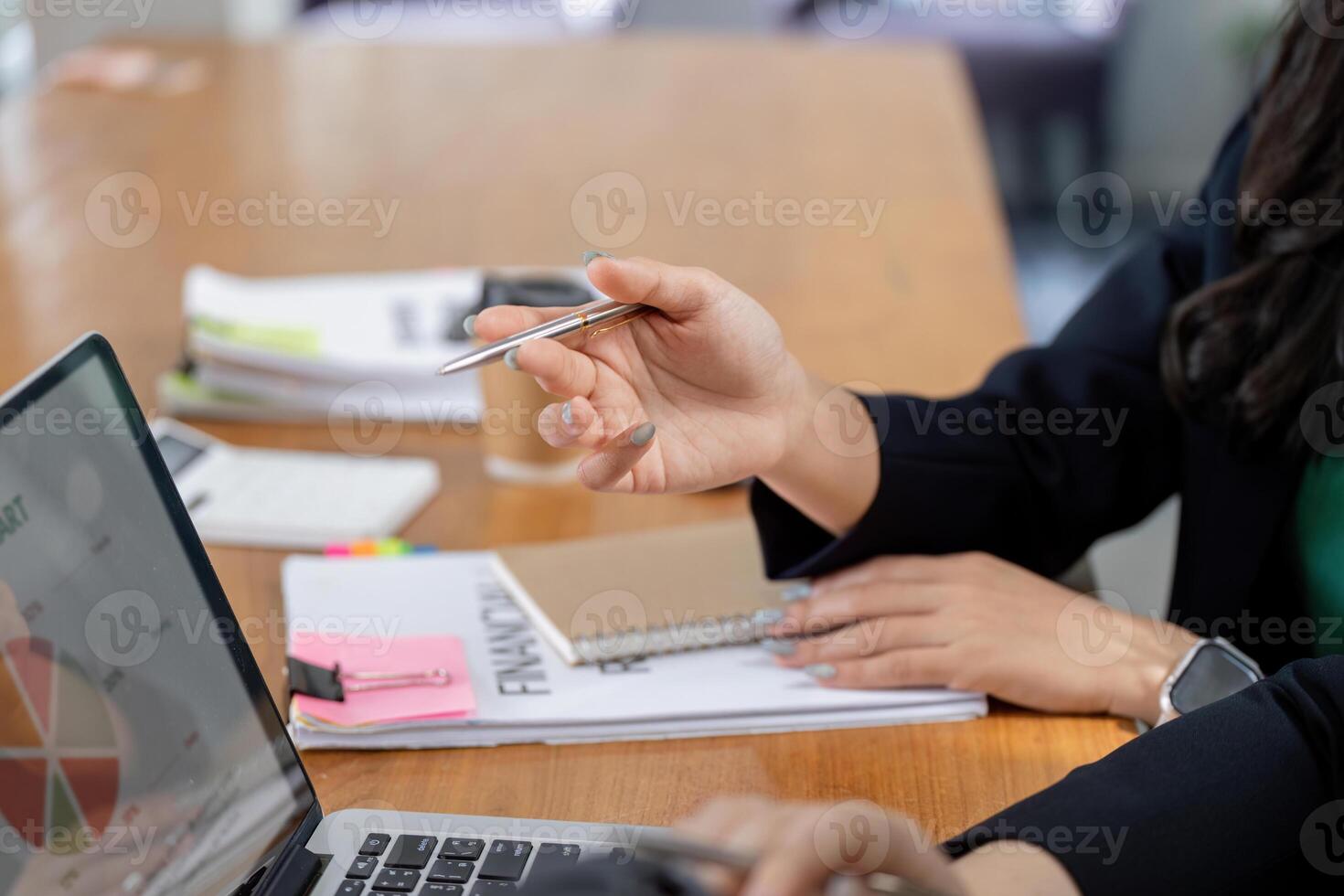 Financial team analyzing data and planning strategies during a meeting. photo