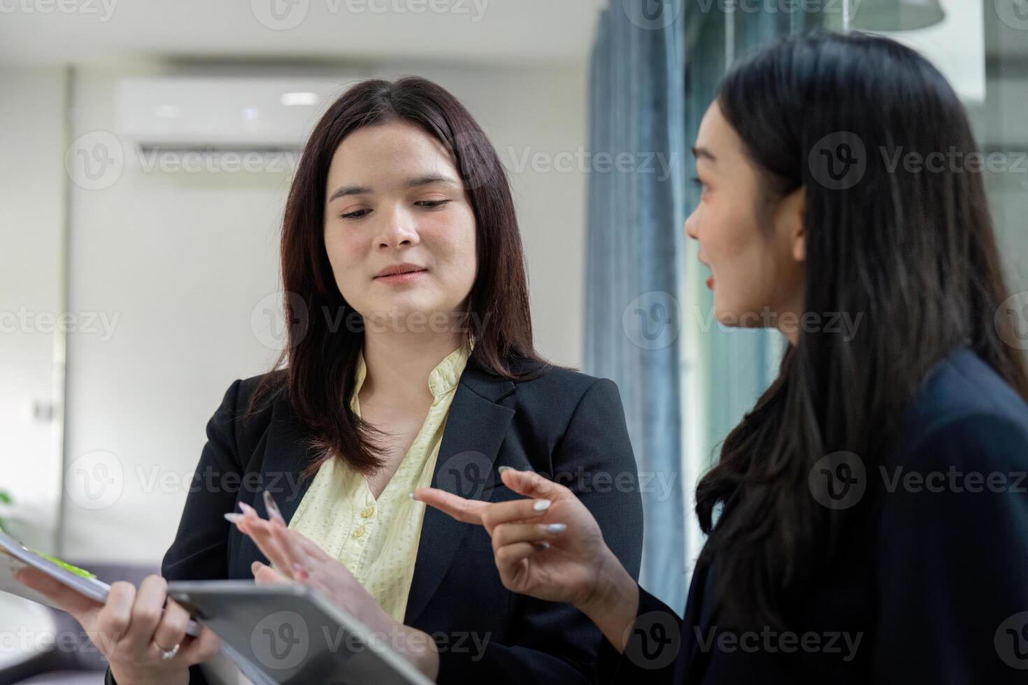Business partners collaborating on financial planning and analysis. photo