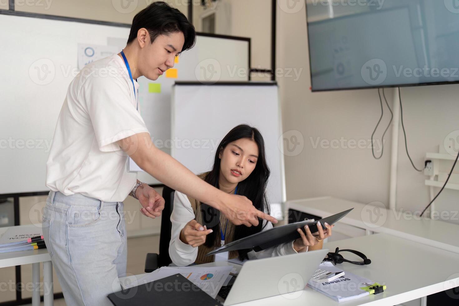 Collaborative financial analysis by young professionals in a contemporary workspace photo