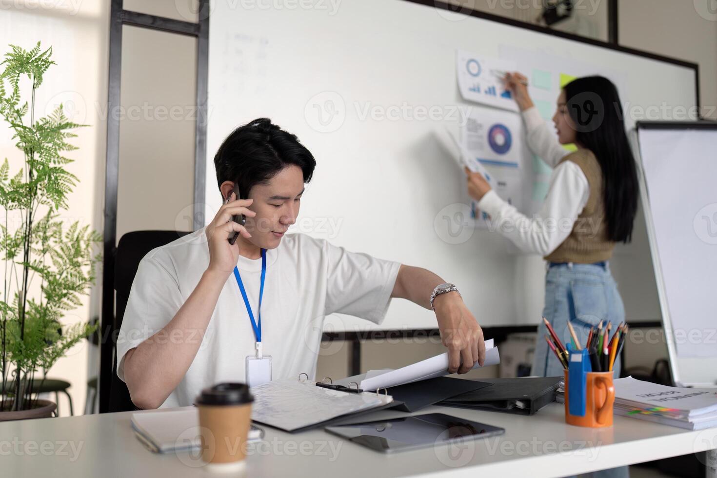 Finance professionals discussing tax deductions and analysis in a modern office setting. photo