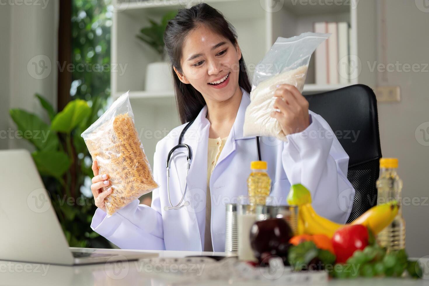 Food selection and consultation. Female nutritionist analyzing nutritional content of pasta and flour. photo