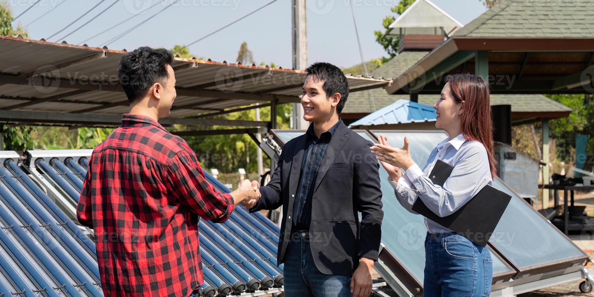 Handshake in sustainable energy. Professionals finalize discussions on solar panel projects, emphasizing teamwork and collaboration. photo