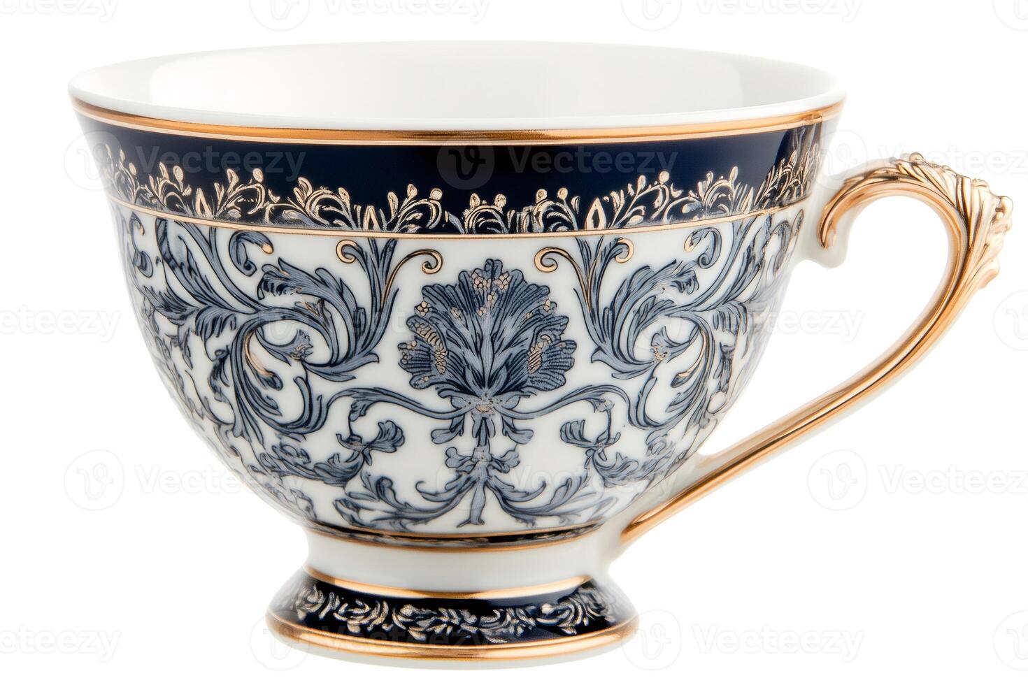 Empty porcelain tea cup with gold decorations and blue ornaments, isolated on white photo