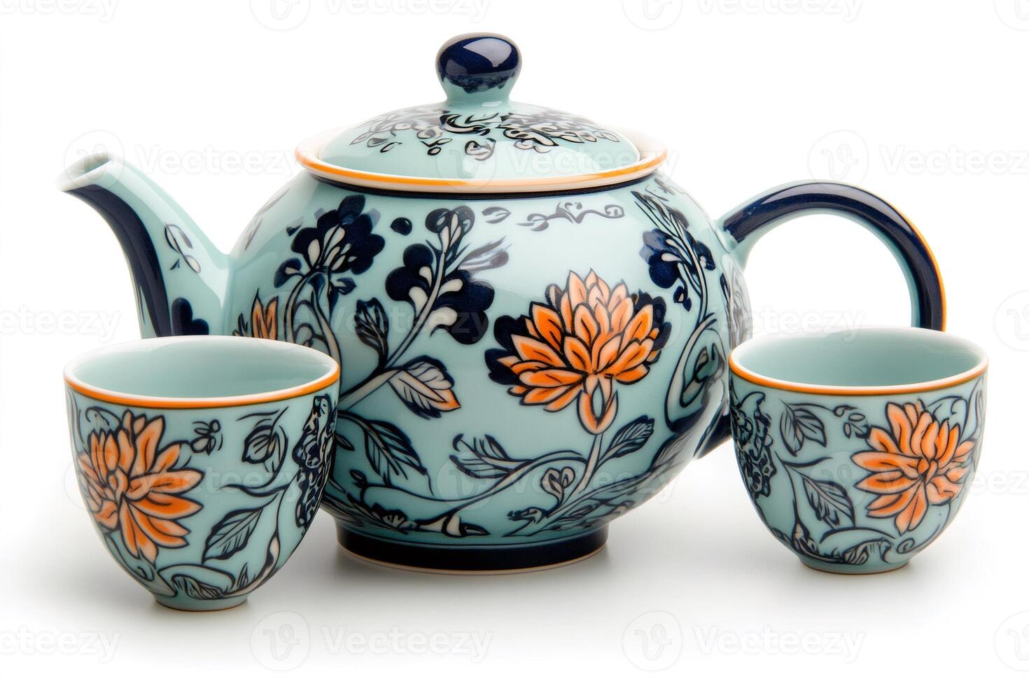 Light blue ceramic teapot with two matching cups decorated with orange flowers and dark blue leaves photo