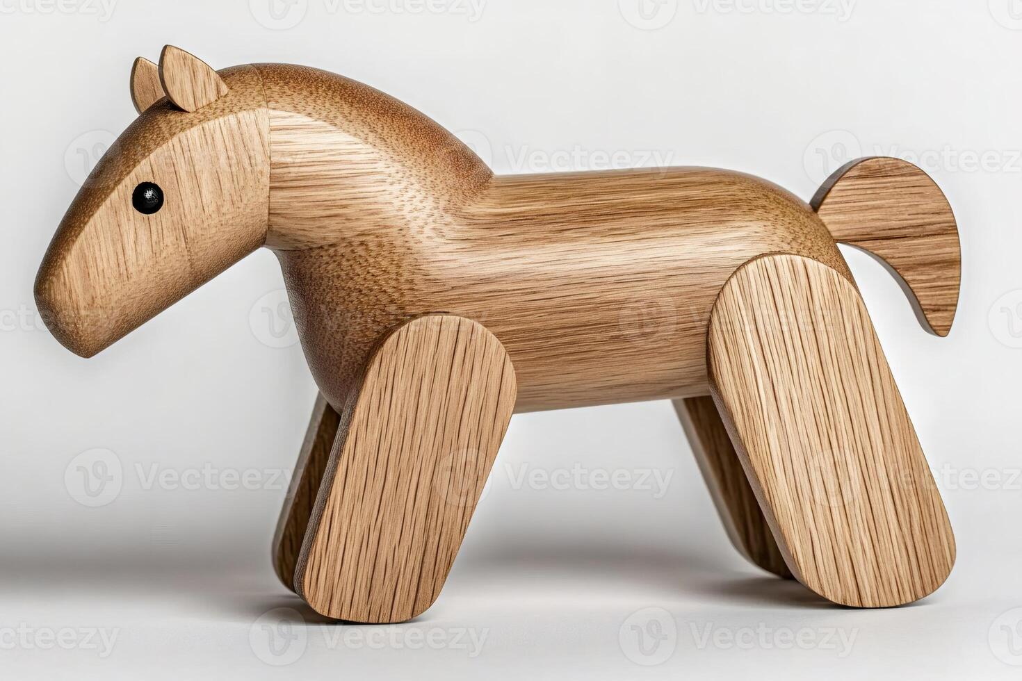 Wooden horse toy standing on white background photo