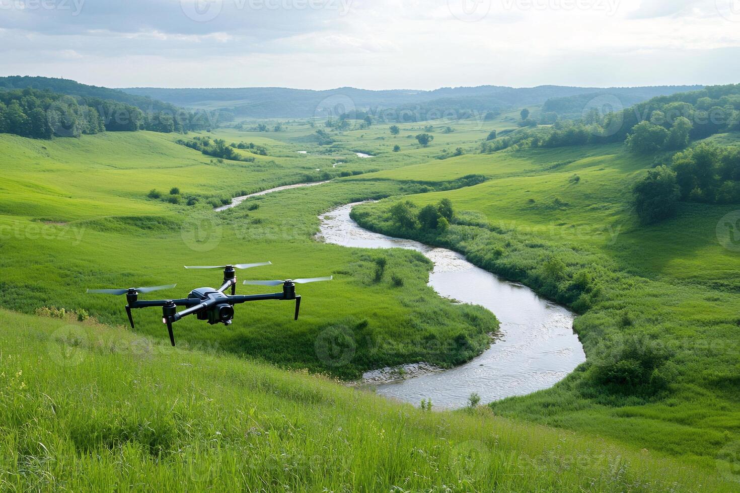 Drone flying over green summer valley with river and forest photo