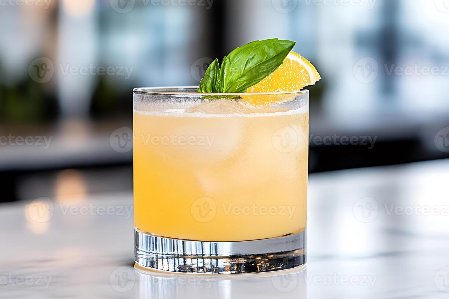 Refreshing whiskey sour cocktail is garnished with orange slice and basil leaves photo