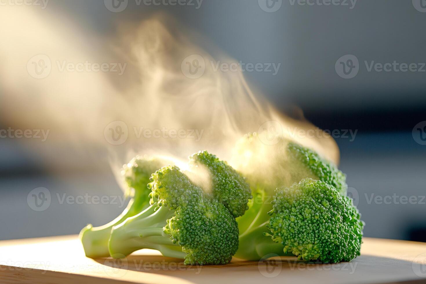 Fresh steaming broccoli florets on wooden cutting board illuminated by sunlight photo