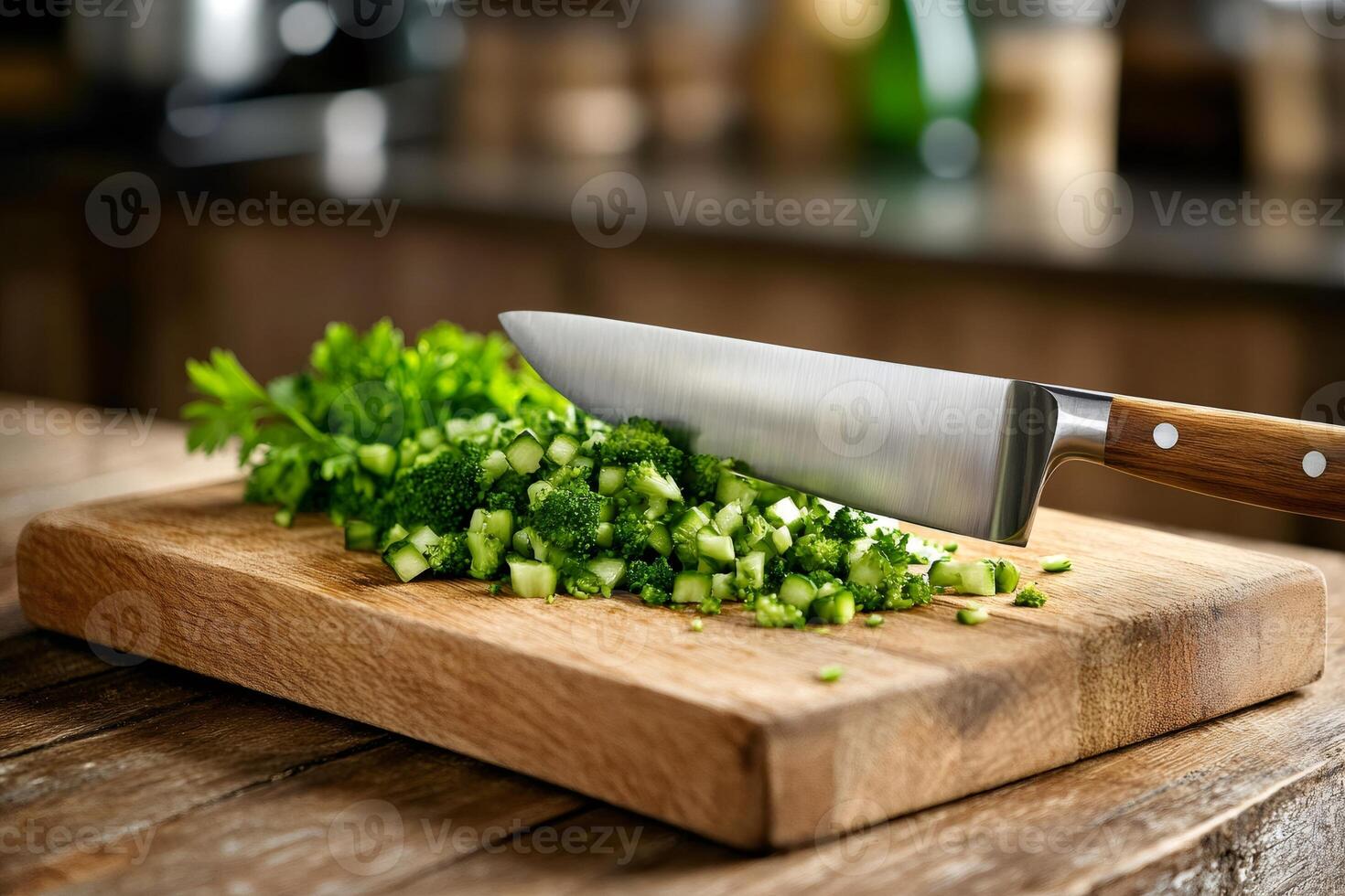 Chef chopping fresh broccoli florets on wooden cutting board with sharp knife photo