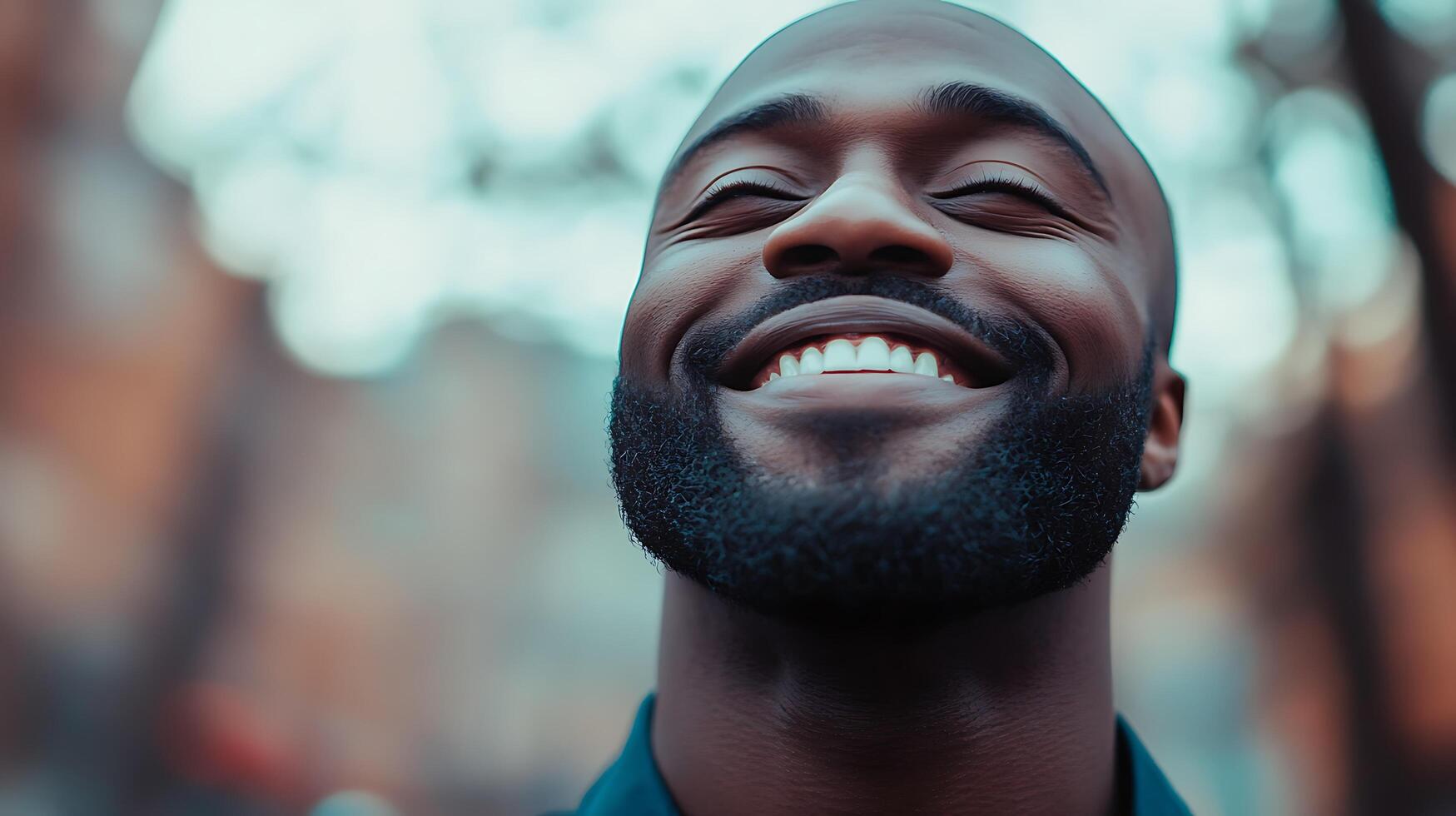 Man smiles with eyes closed a vision of pure joy and serenity He looks peaceful and filled with positive vibes Outdoors sunny photo