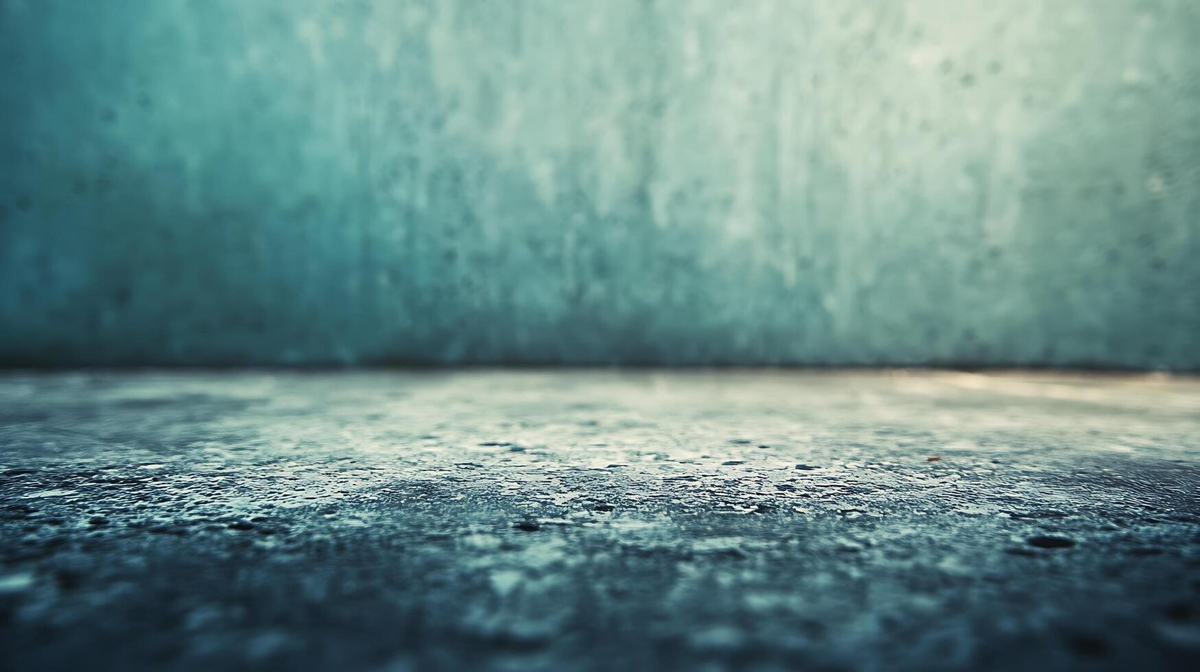 A grey and blue wall with a grey floor photo