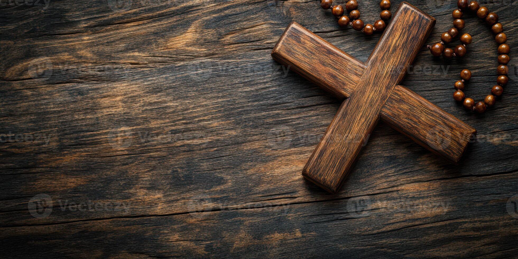 Wooden cross with rosary beads displayed on rustic wooden table creating a calm and reflective atmosphere photo