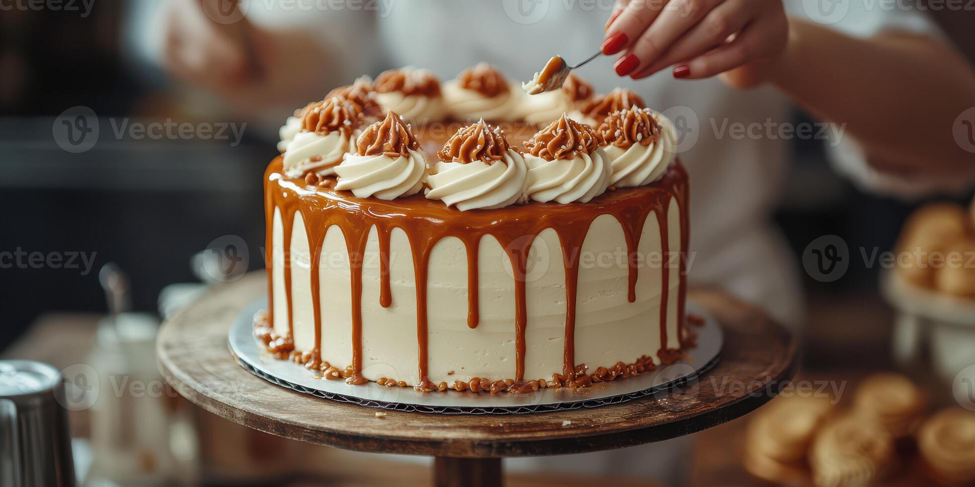 Baker decorating a caramel cake with whipped cream and nuts in a cozy kitchen setting photo