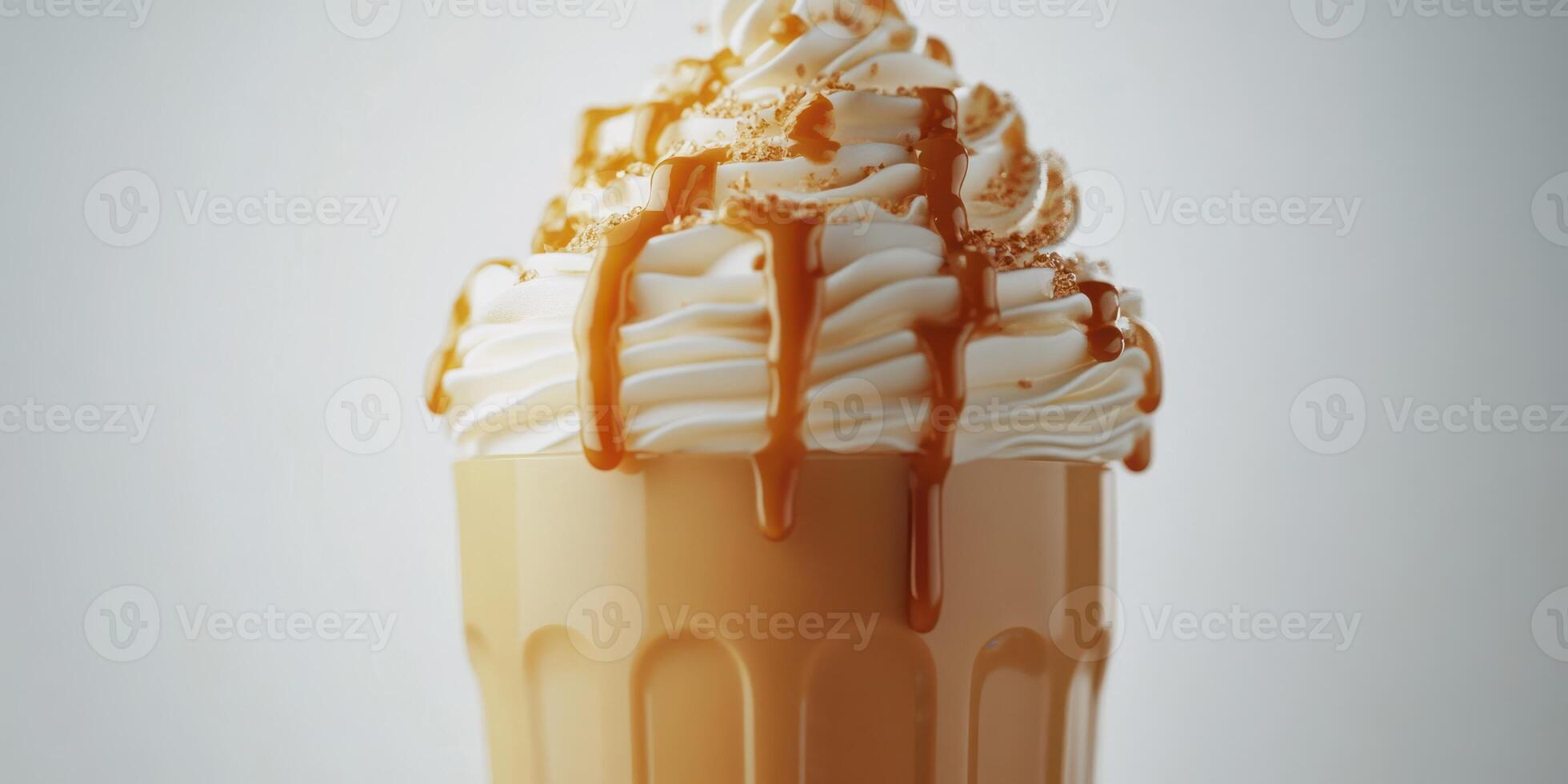 Creamy caramel dessert served in a glass with whipped topping and drizzle at a cozy cafe photo