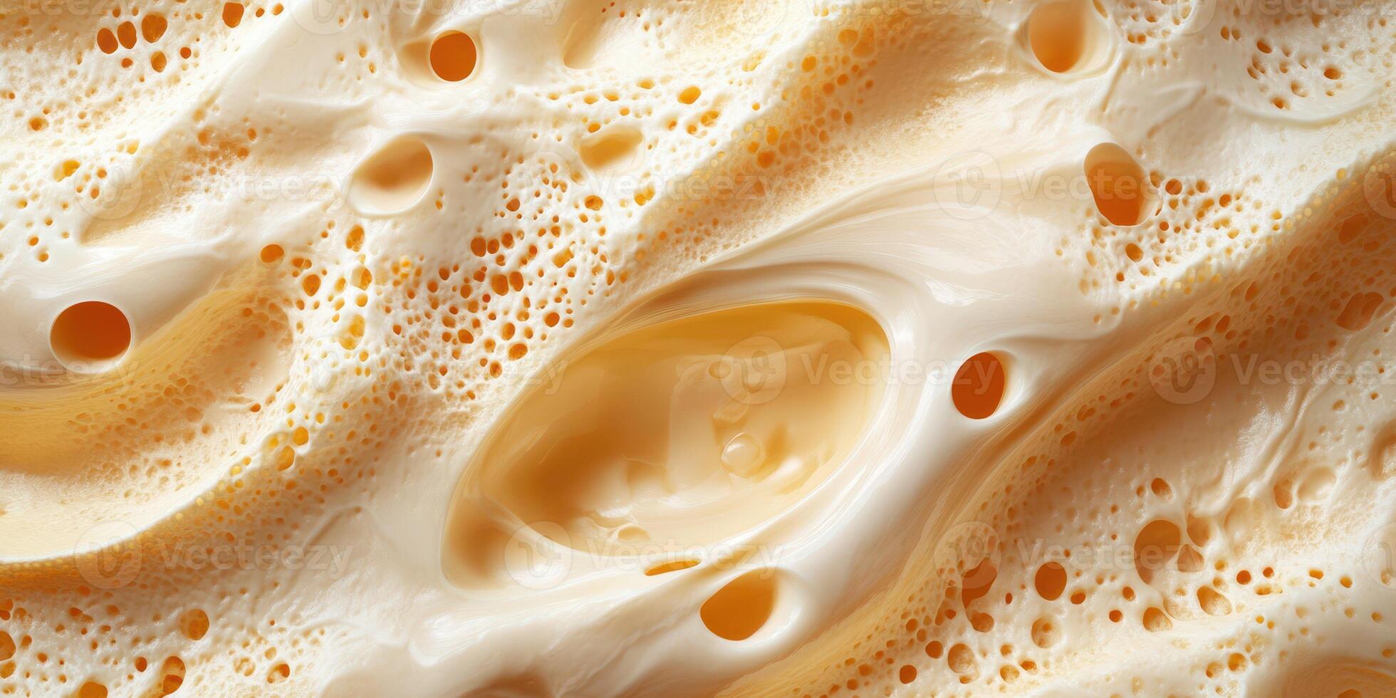 A close-up view of creamy foam resembling ice cream or frothy beverage with intricate textures and bubbles photo