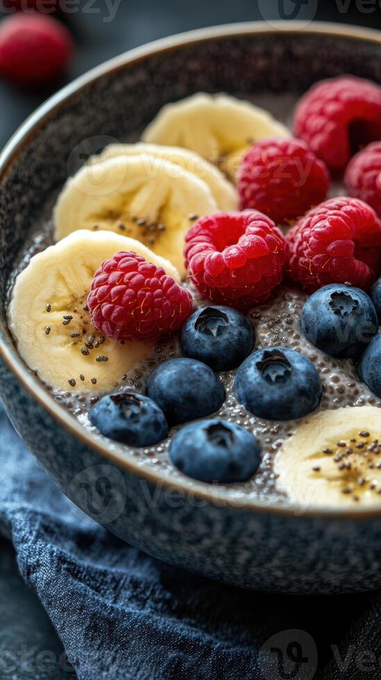 Delicious and nutritious chia seed pudding topped with fresh berries and banana slices in a cozy kitchen setting photo