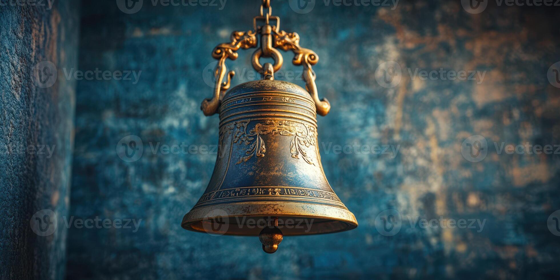 Historical bronze bell displayed against a textured background showcasing intricate designs and craftsmanship photo