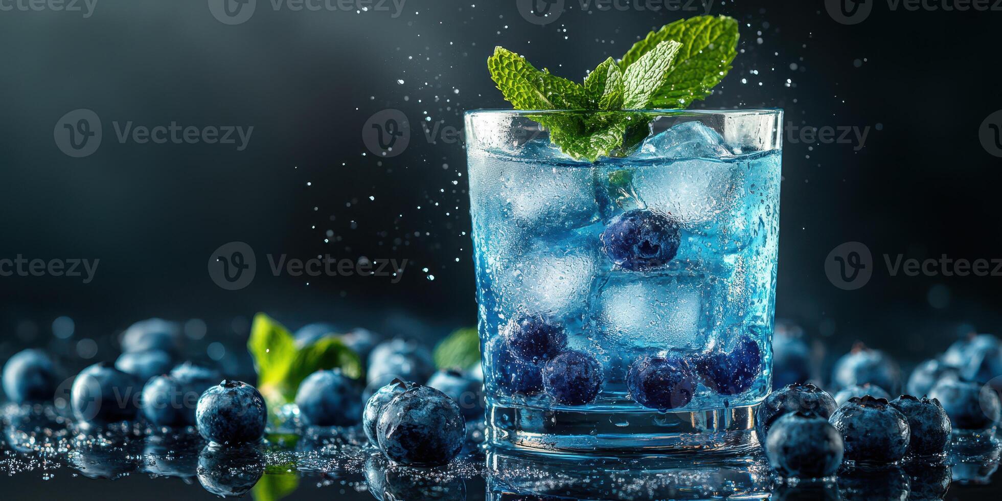 Refreshing blueberry cocktail with ice and mint leaves served in a glass photo