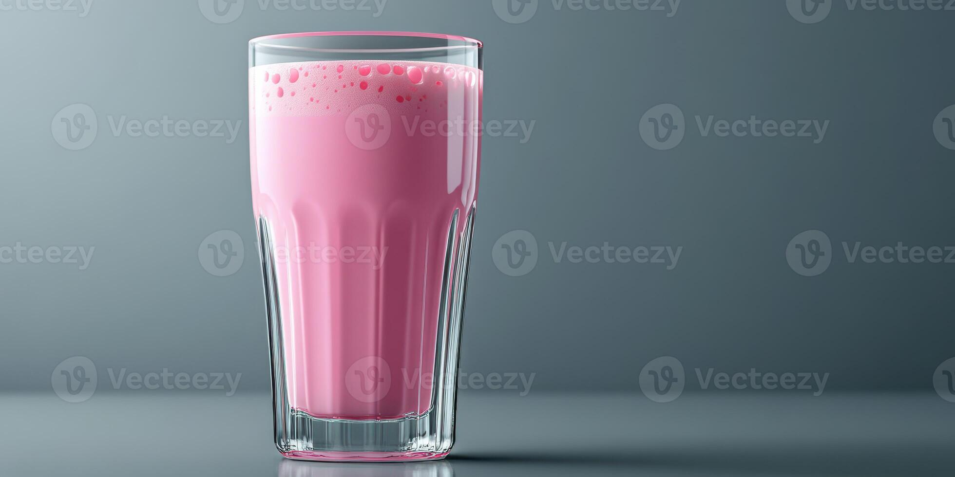 Refreshing pink drink served in a glass on a smooth surface with a modern backdrop, perfect for a hot day or a special occasion photo