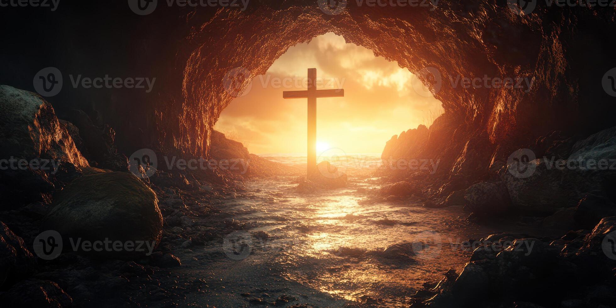 Sunset view of a cave with a cross under a glowing sky by the ocean photo