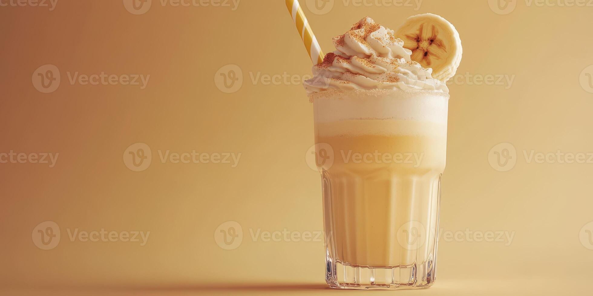 Creamy banana shake with whipped topping, presented on a warm-toned background photo