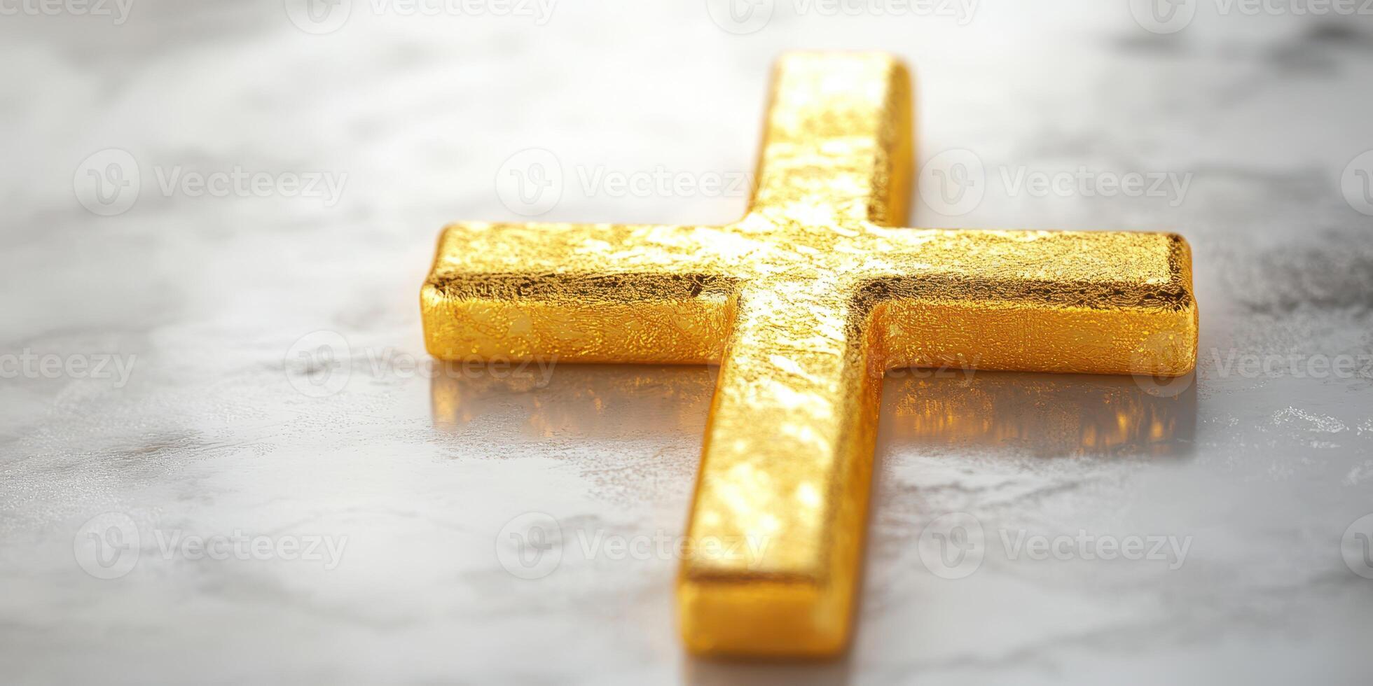 Golden cross placed on a textured surface reflecting light in a serene setting photo