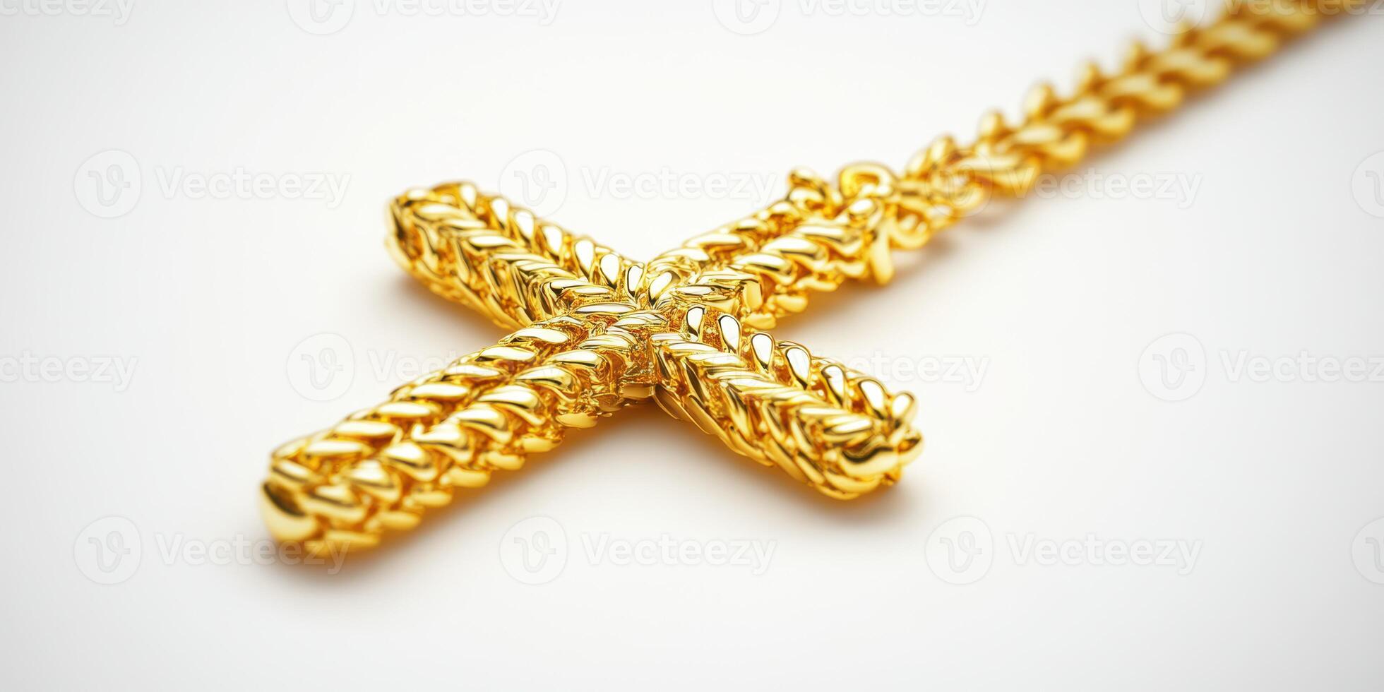 Golden cross necklace with intricate chain design displayed on a neutral background photo
