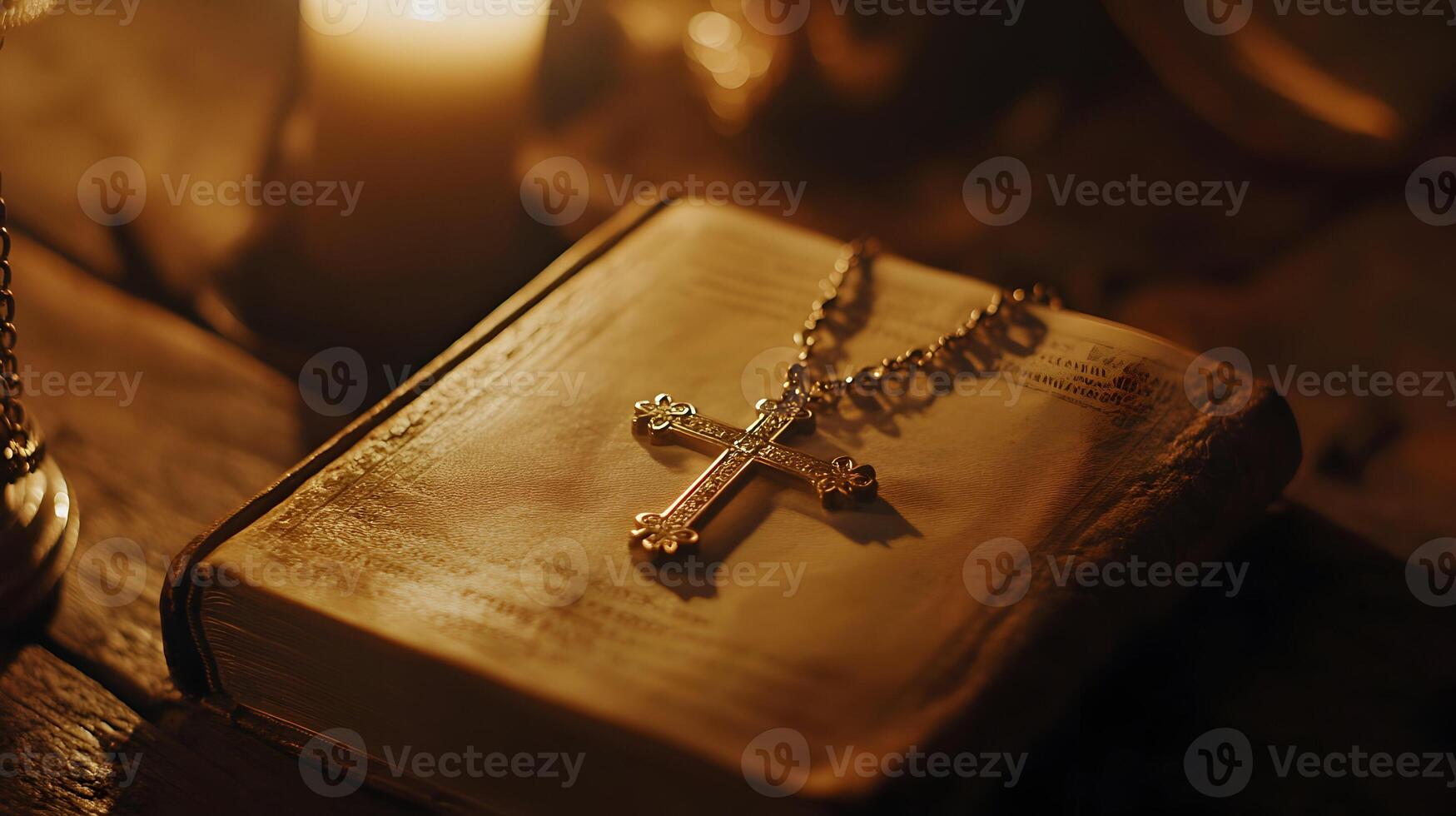 Intimate Still Life of Antique Book and Cross Necklace in a Candlelight Setting photo