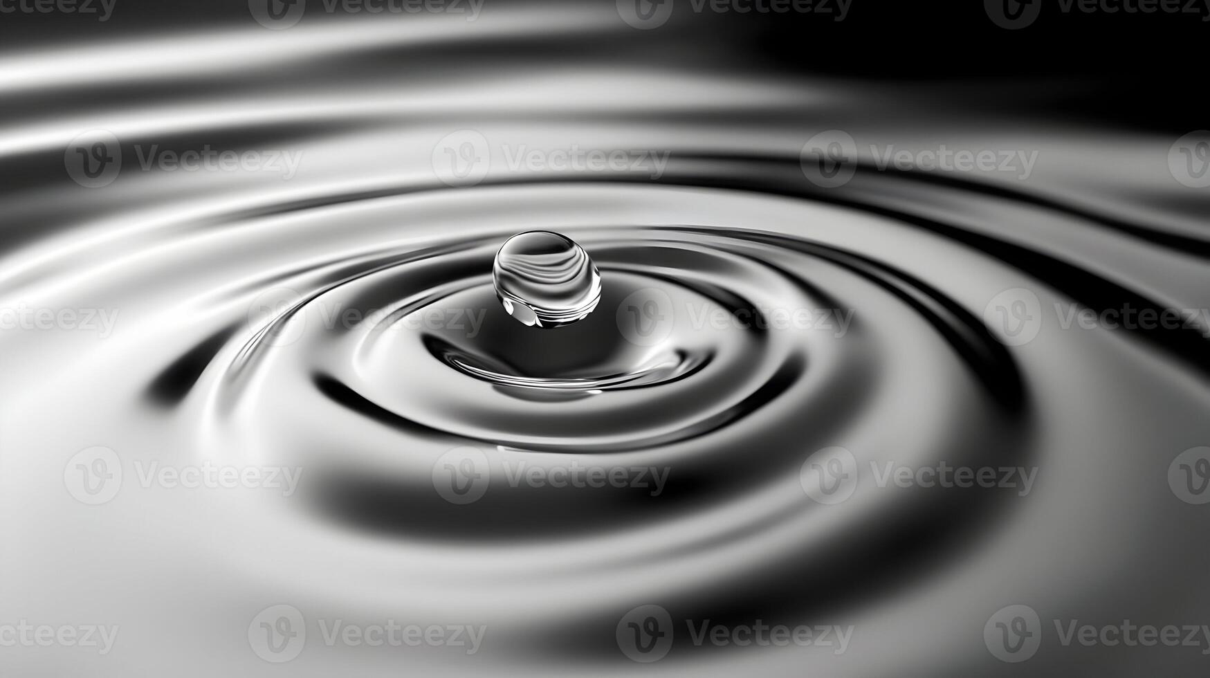 Rippling liquid surface with a floating sphere creating smooth wave patterns monochrome effect photo