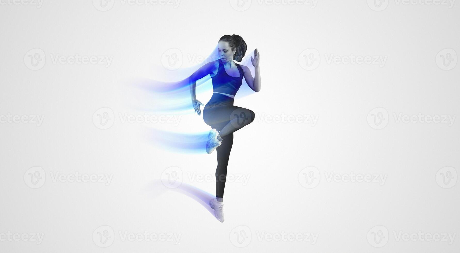 A woman dressed in a black sports bra top and black leggings is engaged in a workout routine. She is focused and determined while performing physical exercises to maintain fitness and strength. photo