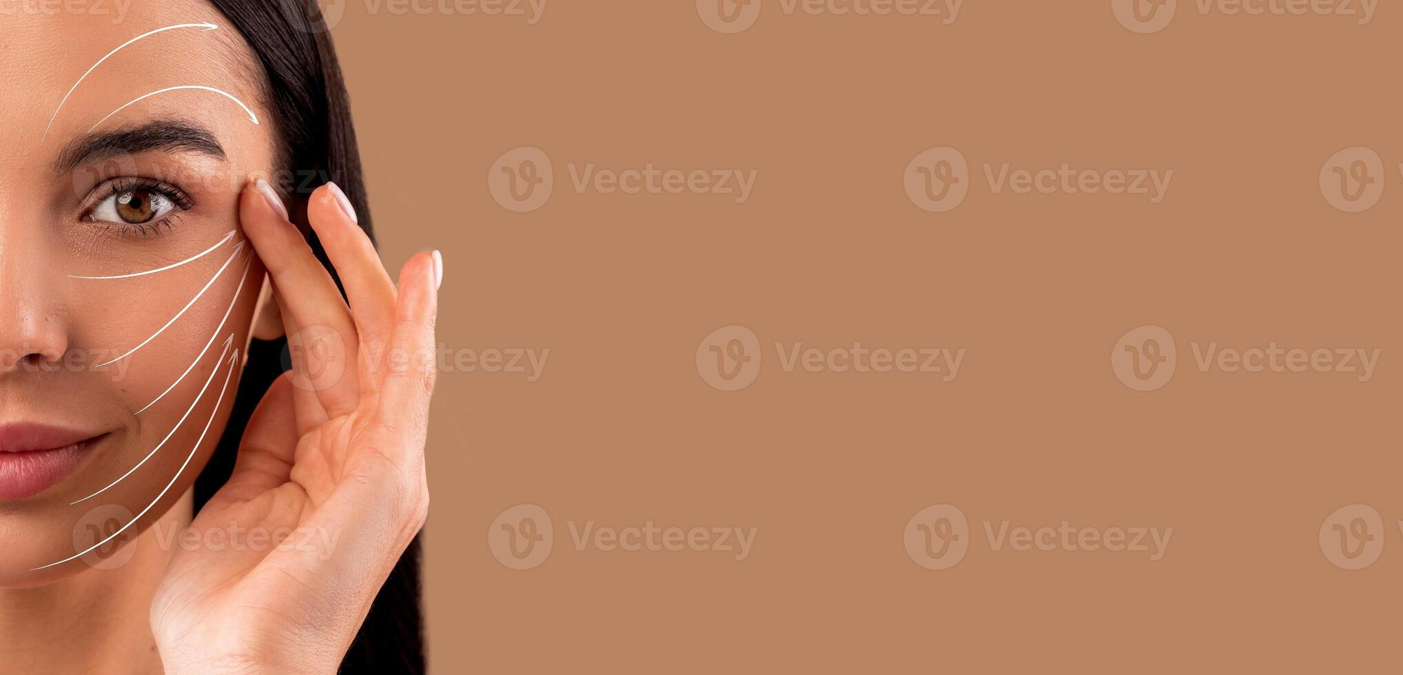 A woman performs a facial massage focusing on skin care and rejuvenation techniques. She emphasizes anti-aging methods while enjoying a pampering moment of self-care in a serene setting, copy space photo