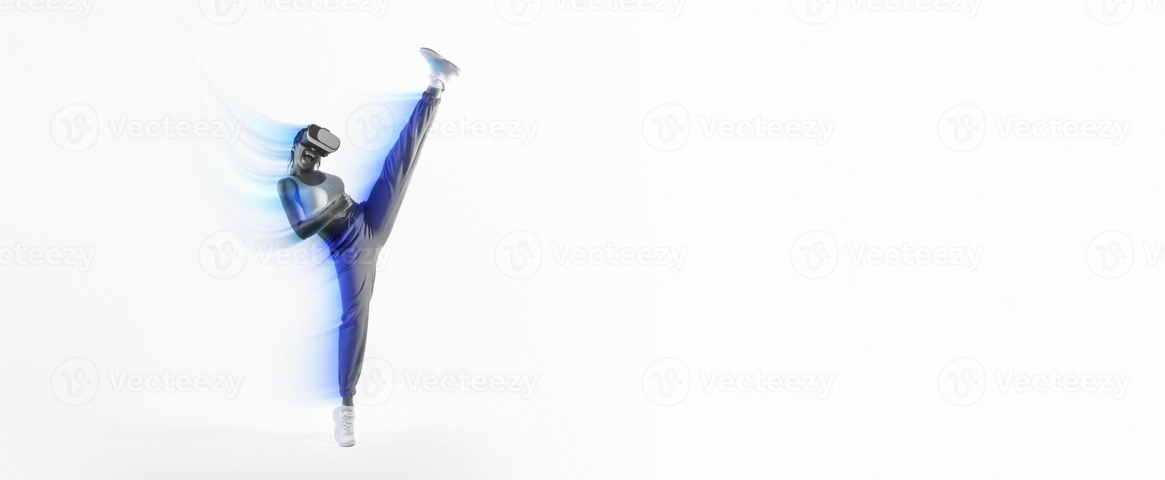Young fit woman throwing kick in immersive virtual reality game, lady gaming with virtual reality goggles over pink neon studio background, full length. Energetic person having a 3D experience photo