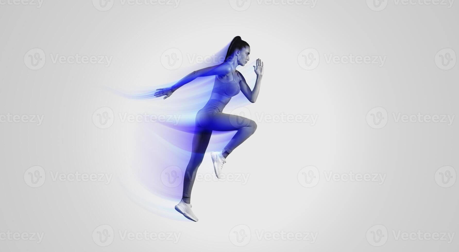 Side View Of Sporty Woman Exercising Running Or Doing Elbow-To-Knee Crunch Standing Posing In Mid-Air On Blue Studio Background, Looking Aside. Sport And Fitness Motivation. Full Length photo