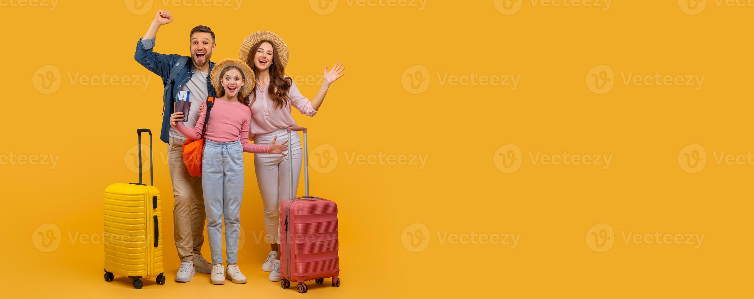 A cheerful family of three, featuring a man, woman, and child, are excited about their upcoming trip. The parents stand with their arms raised in jubilation while the child clings to the woman hand photo