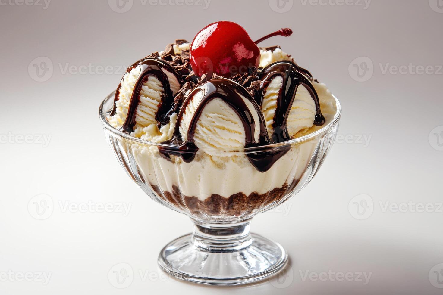 Delightful sundae topped with chocolate and cherry in dessert bowl photo