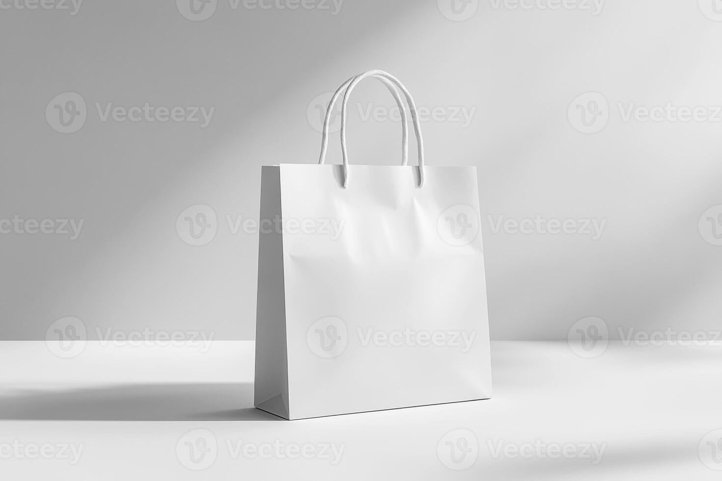 Empty white shopping bag on a minimalist table photo