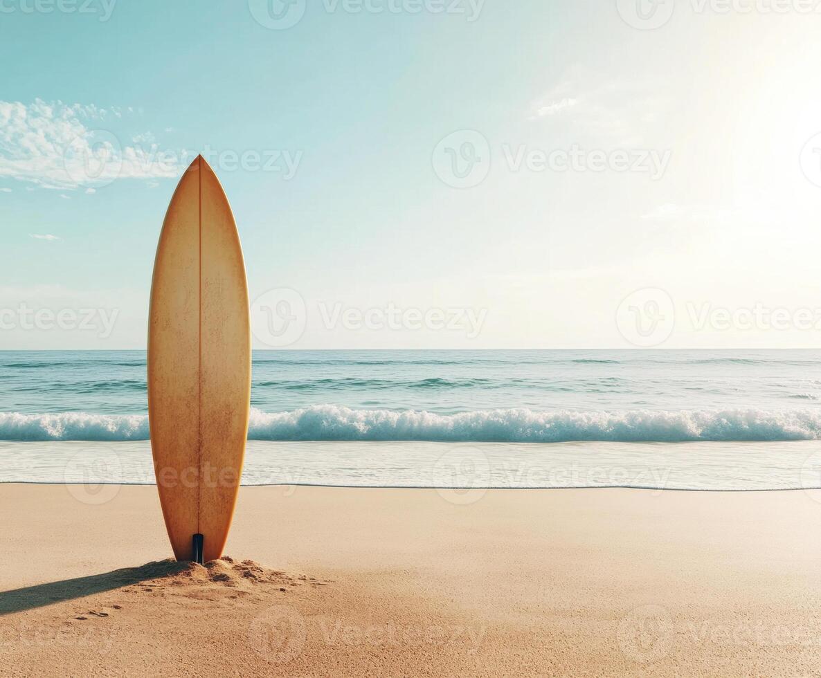 Surfboard stands on golden sand at a tranquil beach during sunset photo